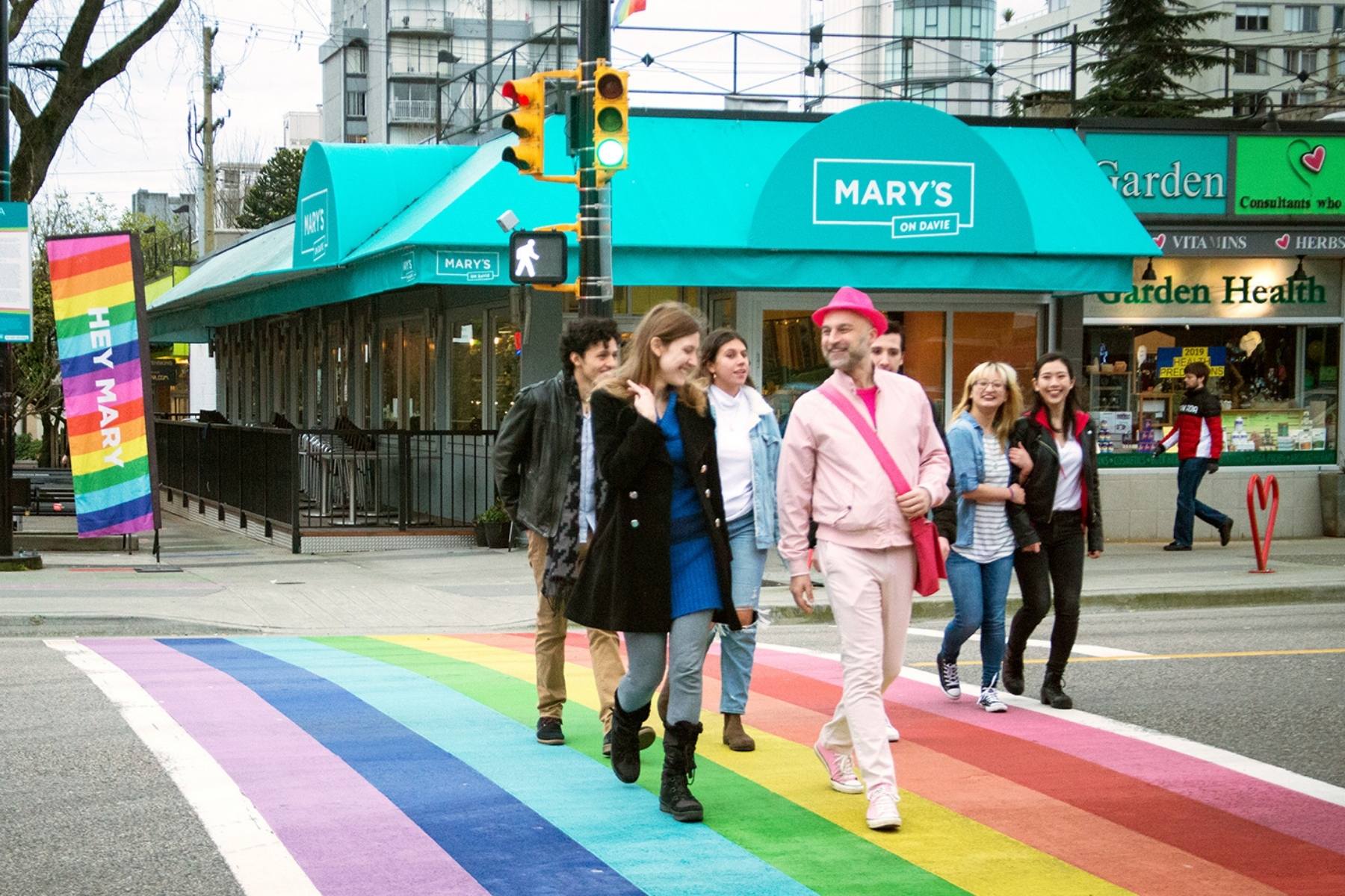 Forbidden Vancouver Walking tour, crossing the rainbow crosswalk in the Davie village.