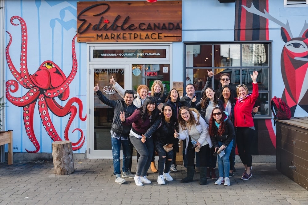 a happy team of coworkers on their team building event with Vancouver Foodie Tours