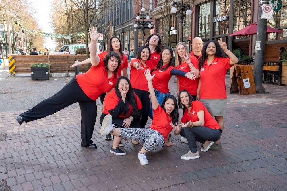 the Vancouver Foodie Tours team of great local guides posing for a happy picture together, reading to bring you the best corporate event ever