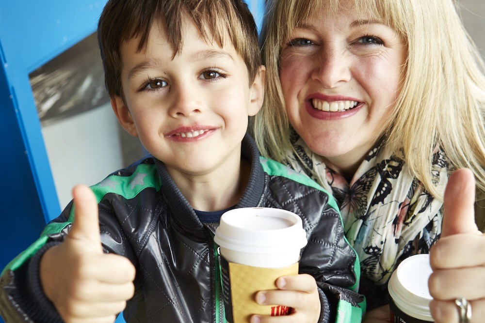 a mother and her son with thumbs up - happy clients on a Granville Island Market Tour