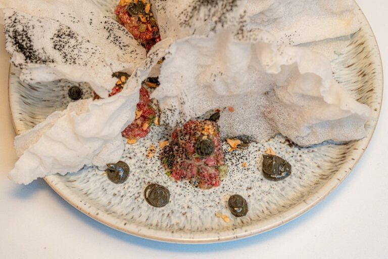 a close-up of a delicious looking dish, professionally served on an intricate plate, that you'll enjoy in one of the best Gastown restaurants in Vancouver