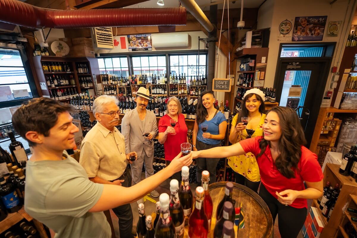 Corporate group enjoying a guided wine tasting during a Vancouver staff party.
