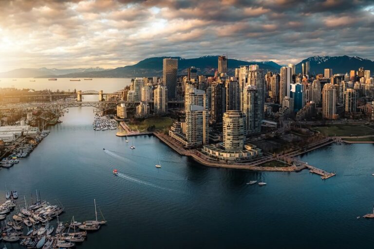 Panoramic view of downtown Vancouver, False Creek, and the North Shore mountains in warm evening light