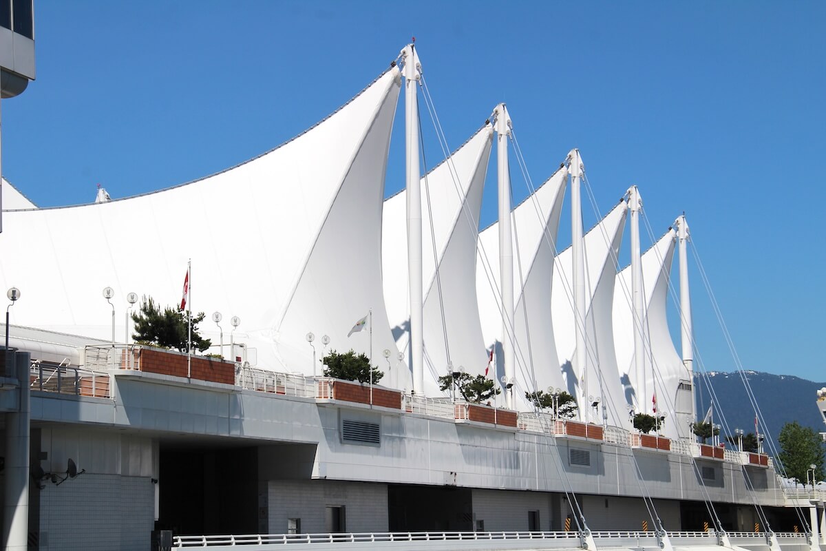 White sails of Canada Place on Vancouver’s waterfront under a clear blue sky.